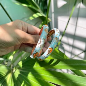 Graceful Sky Blue Enamel Bangles with Golden Floral Detailing