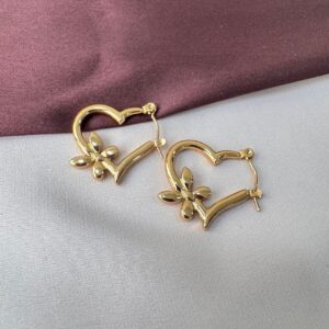 Gold heart hoop earrings with floral accent